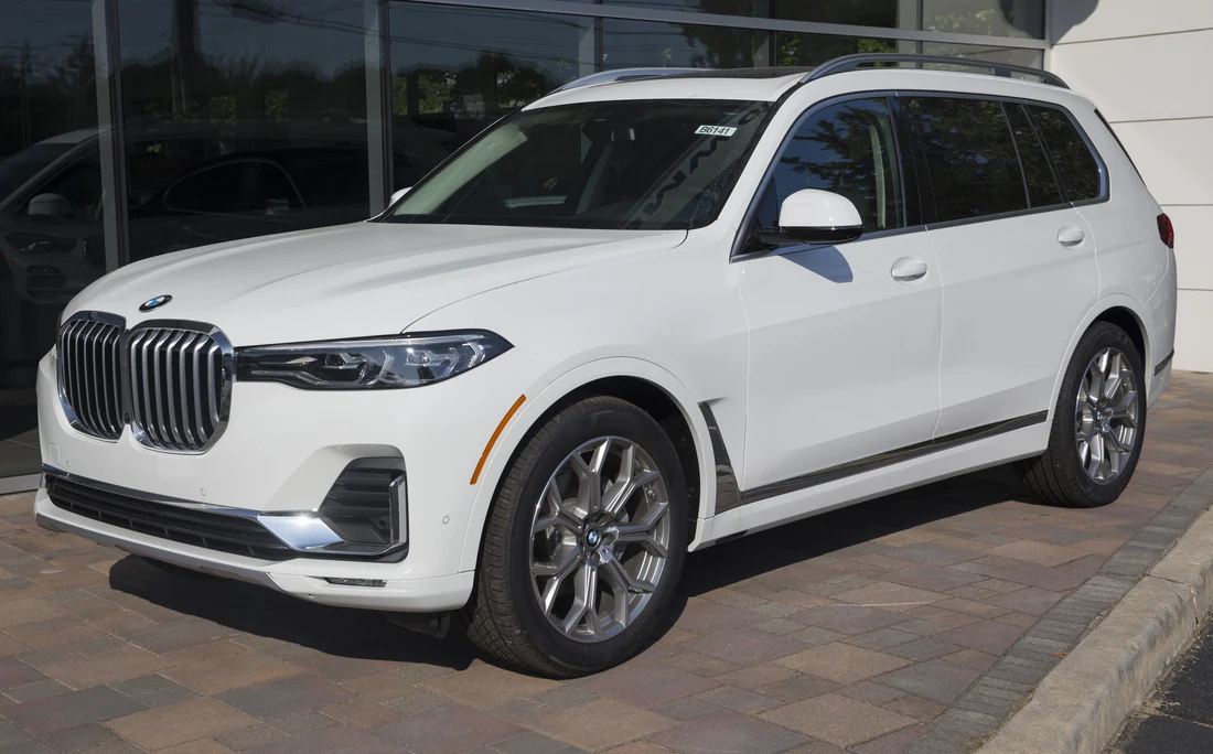 White BMW X7 premium SUV in a front three-quarter view.